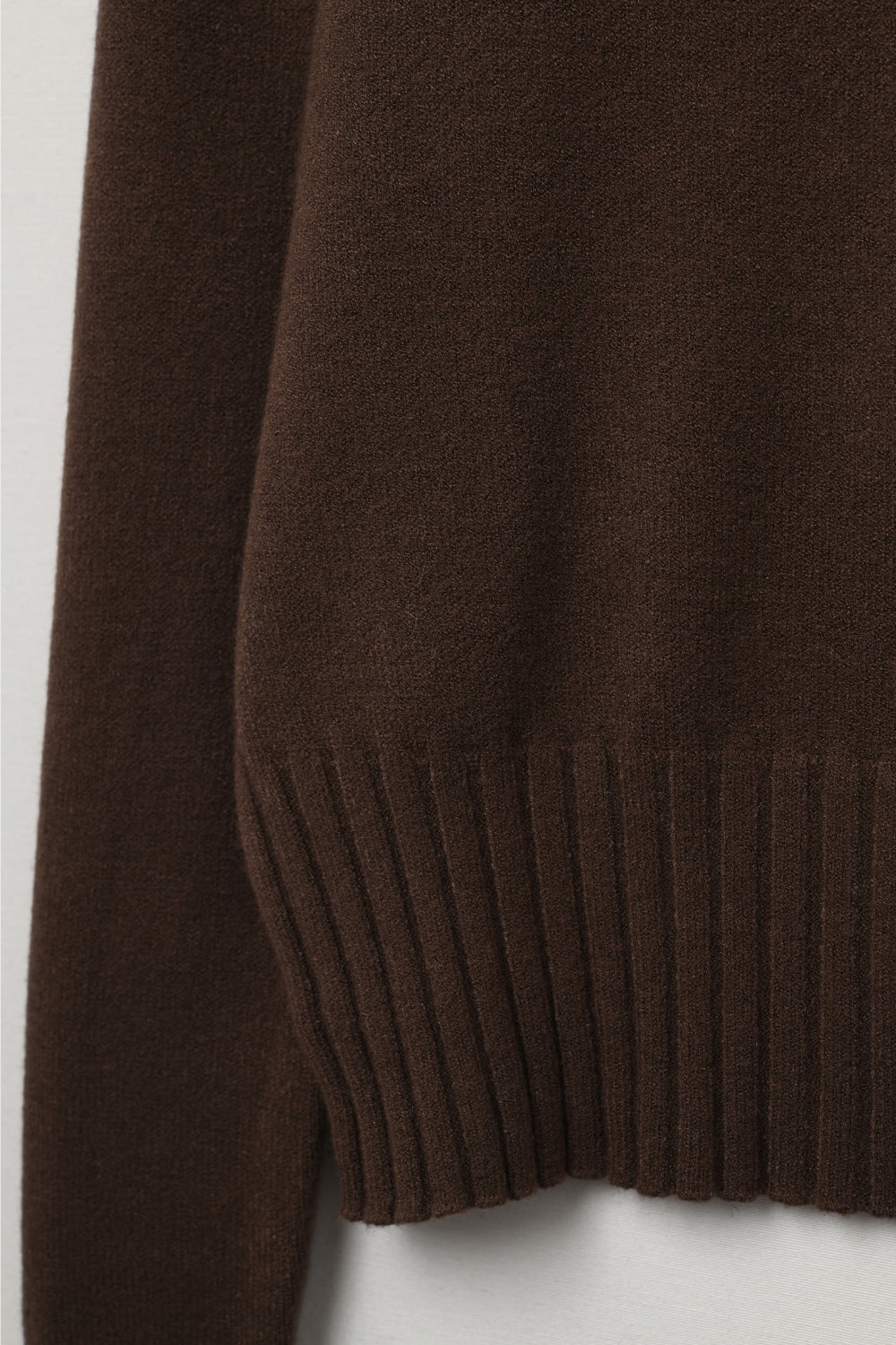 Brown soft knit sweater with ribbed cuffs and neck
