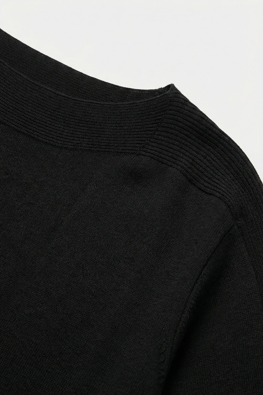 Relaxed black boatneck sweater with dropped sleeves