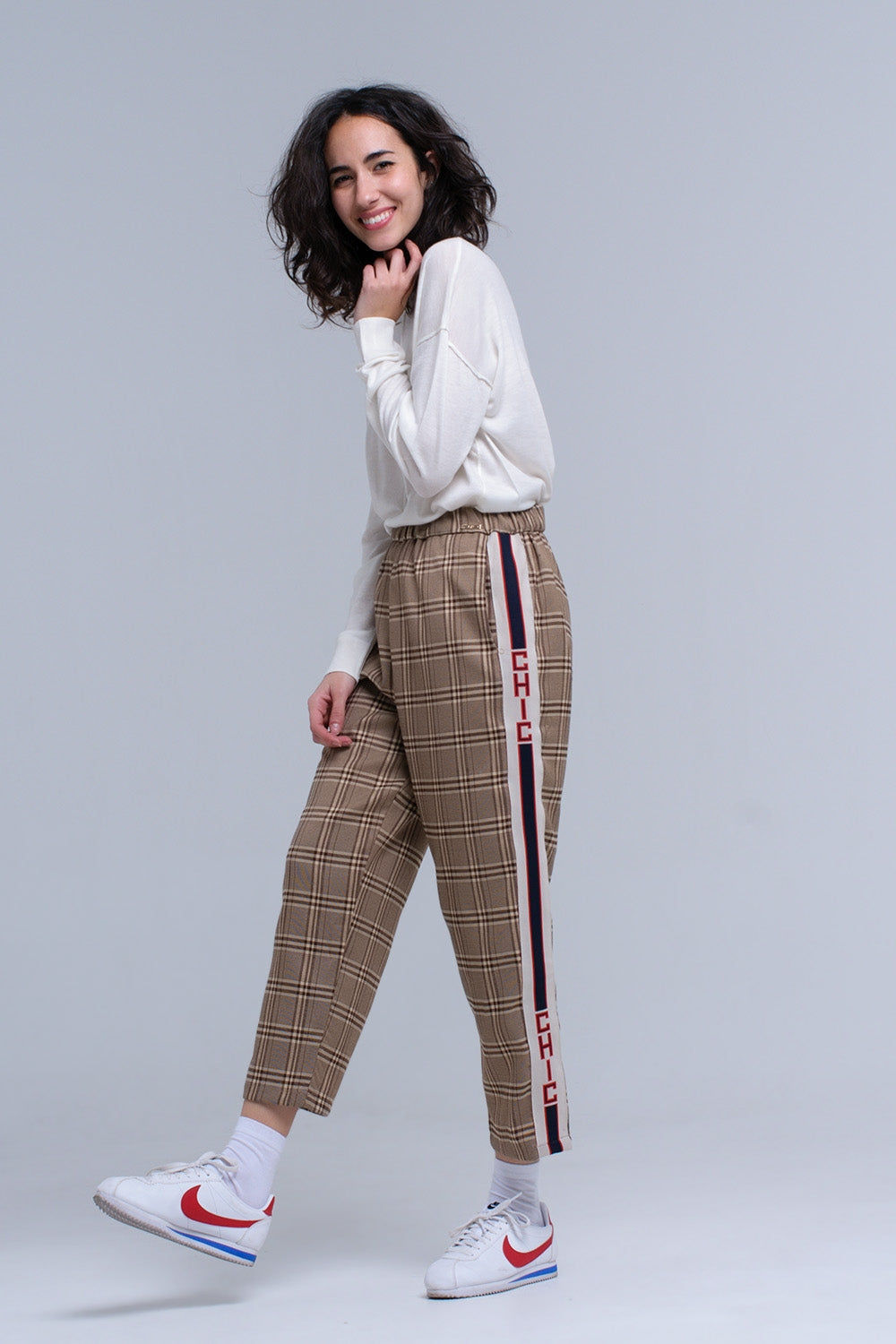 Brown tartan pattern trousers