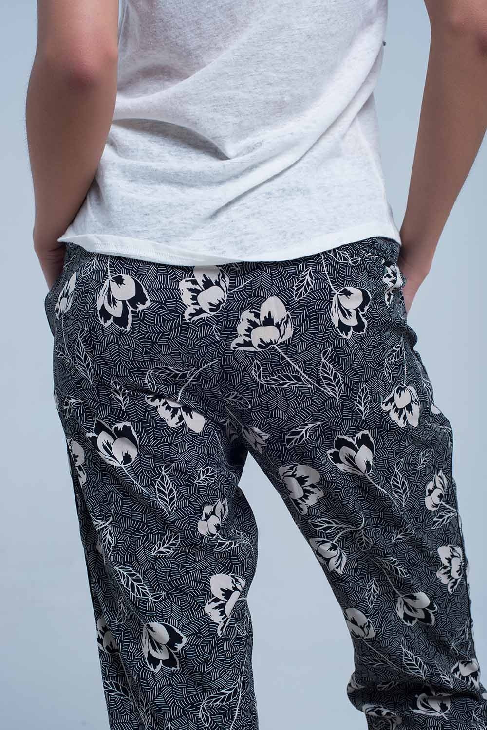 Black pants with floral print - trousers