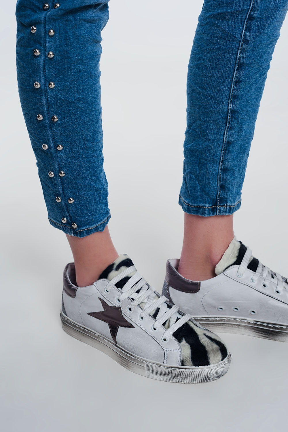 wrinkled denim studded skinny jeans