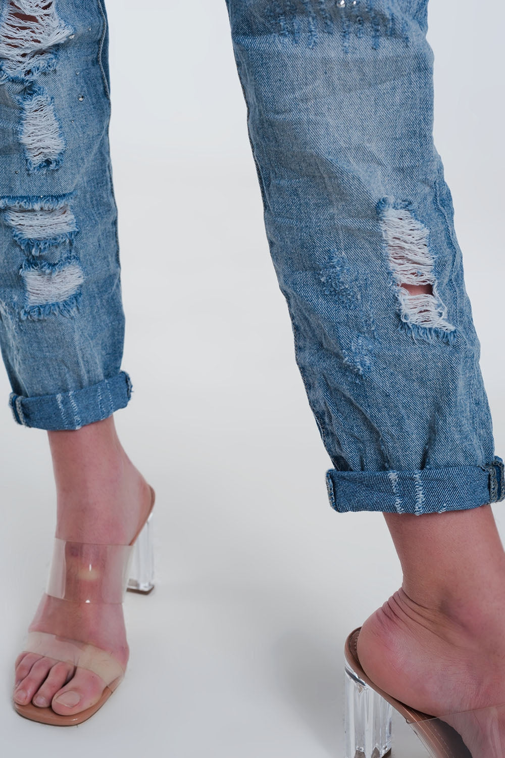 Heavily torn straight jeans in light denim