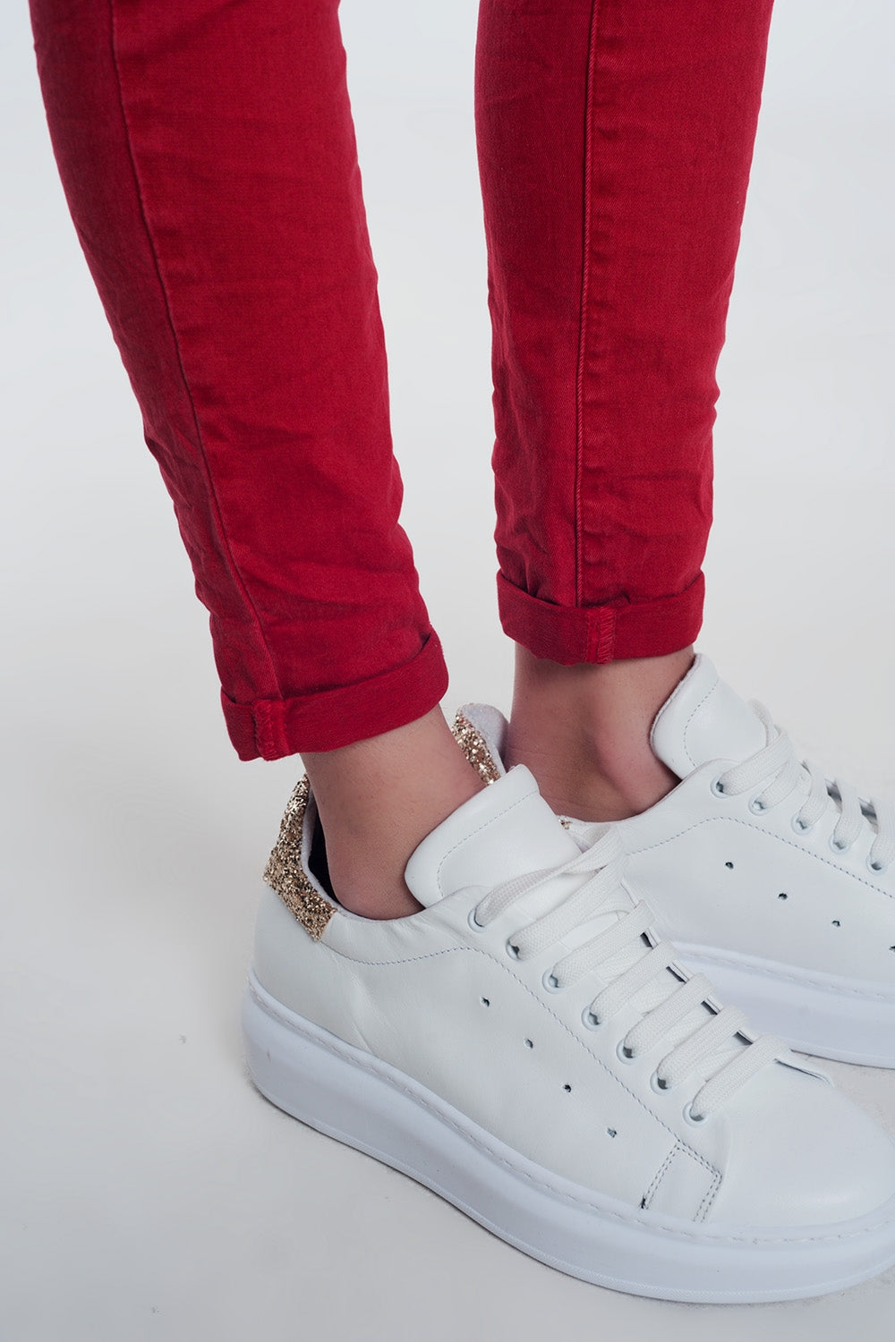 red boyfriend jeans with button closure