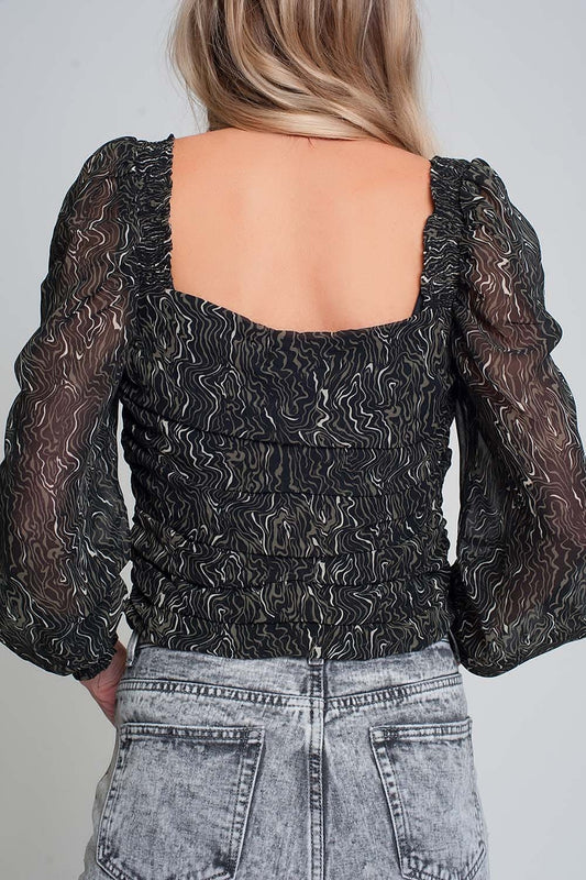 See through top with long sleeves and geo print in black color with elastic cuffs - Shirts