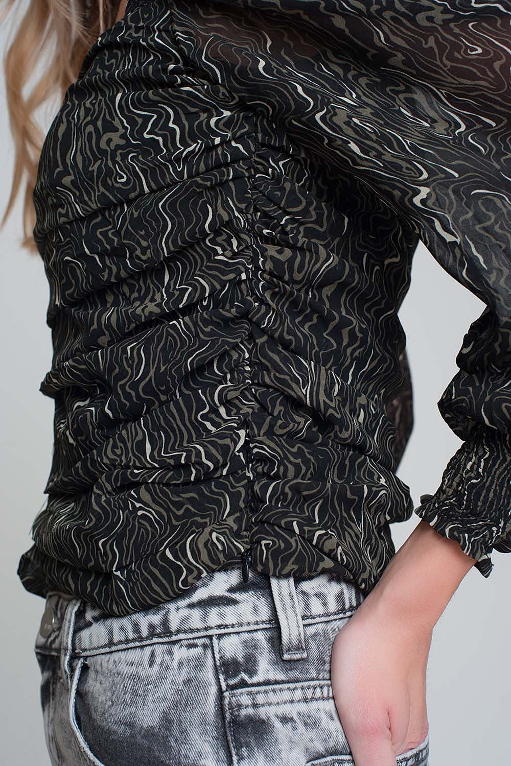 See through top with long sleeves and geo print in black color with elastic cuffs