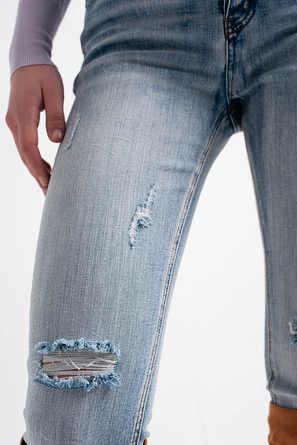 Heather skinny leg distressed jeans with button detail in light blue - Denim
