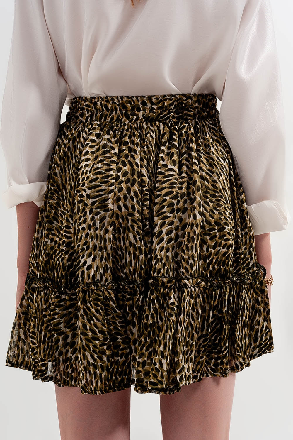 Green chiffon mini skirt with elastic waistband and shiny fabric