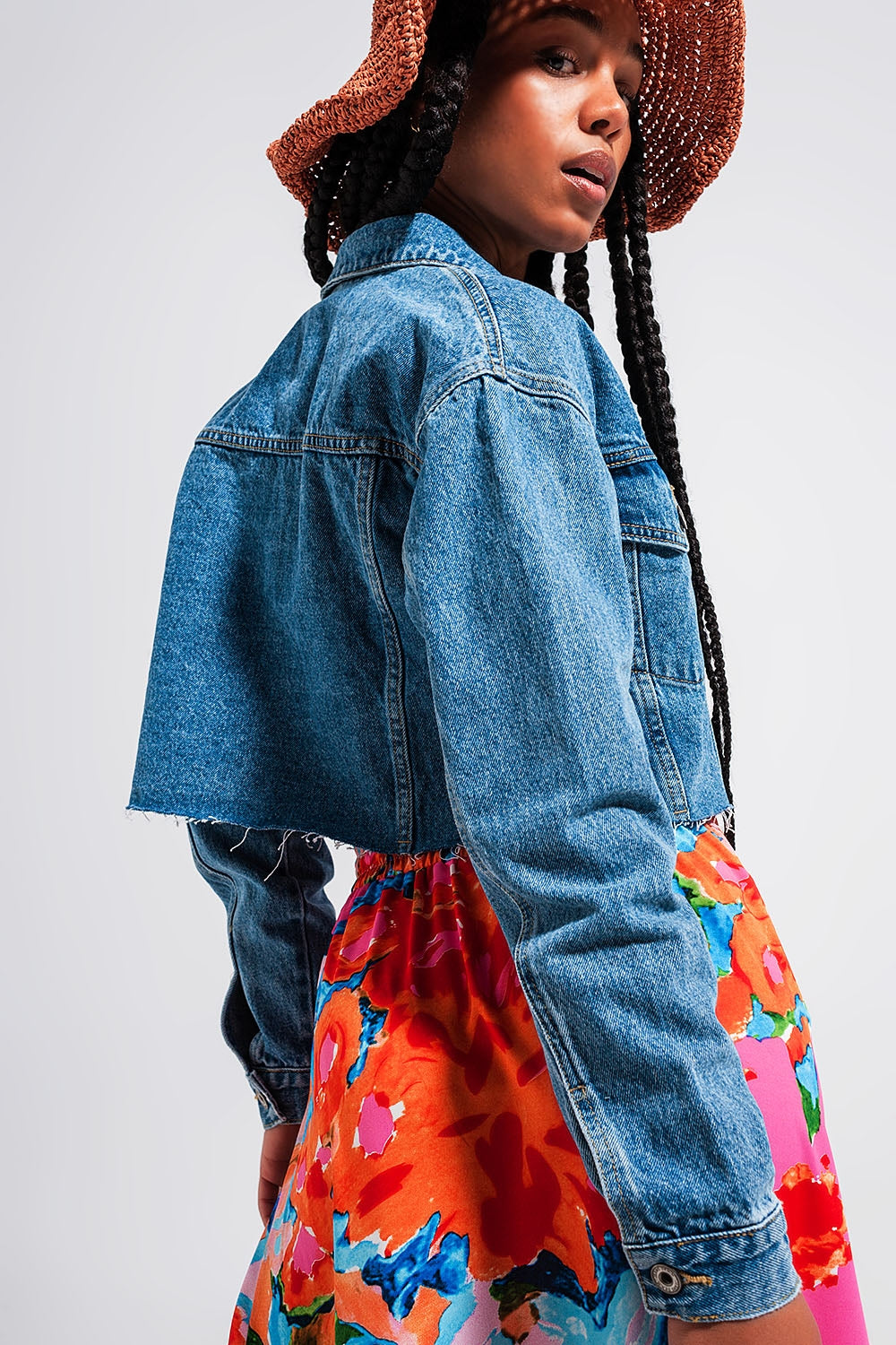 Cropped denim jacket with raw hem in mid wash