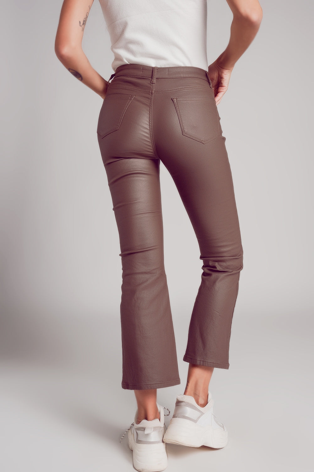 Stretch faux leather flare pants in beige - trousers