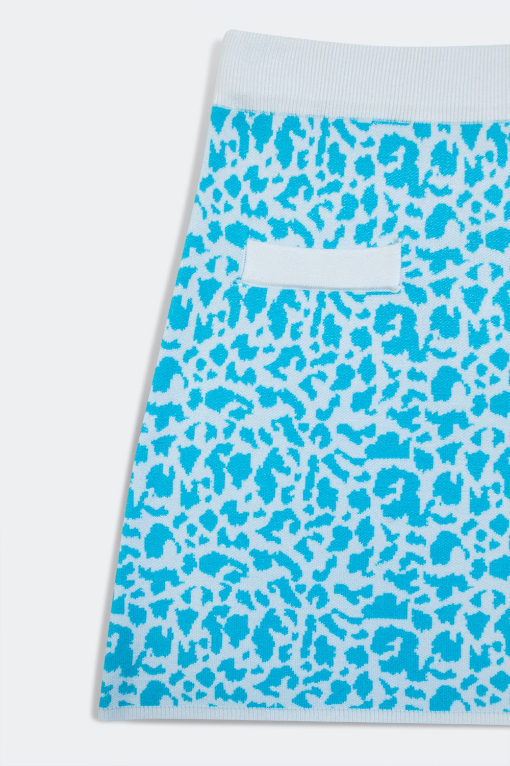 Lightweight knit mini skirt in turquoise animal print