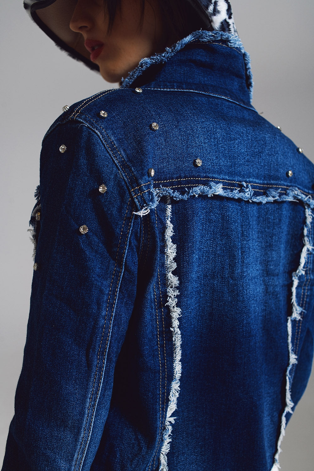 Denim jacket with frayed and embroidered details in Midwash