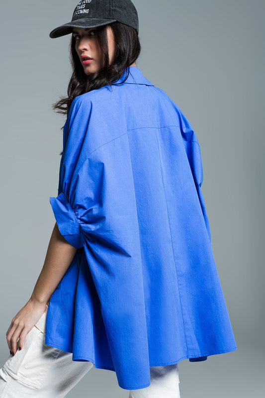 Blue oversized blouse with short sleeves