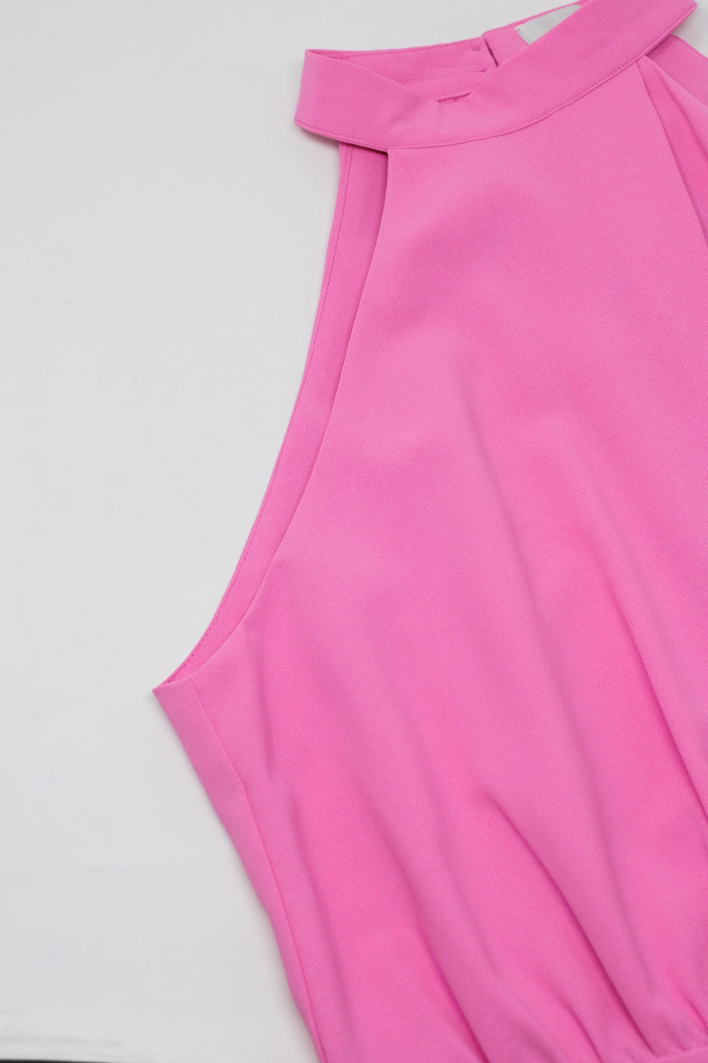 Pink jumpuits with top crossed and high collar
