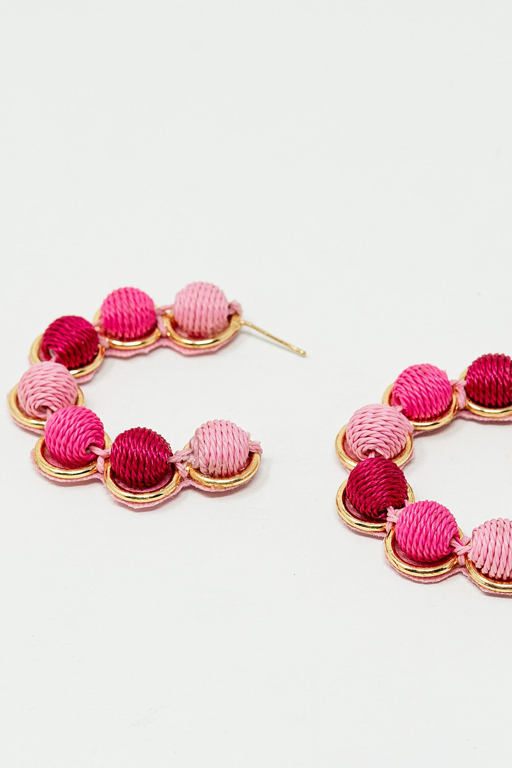 Gold Hoop Earring With Woolen Spheres in Pink and Fuchsia