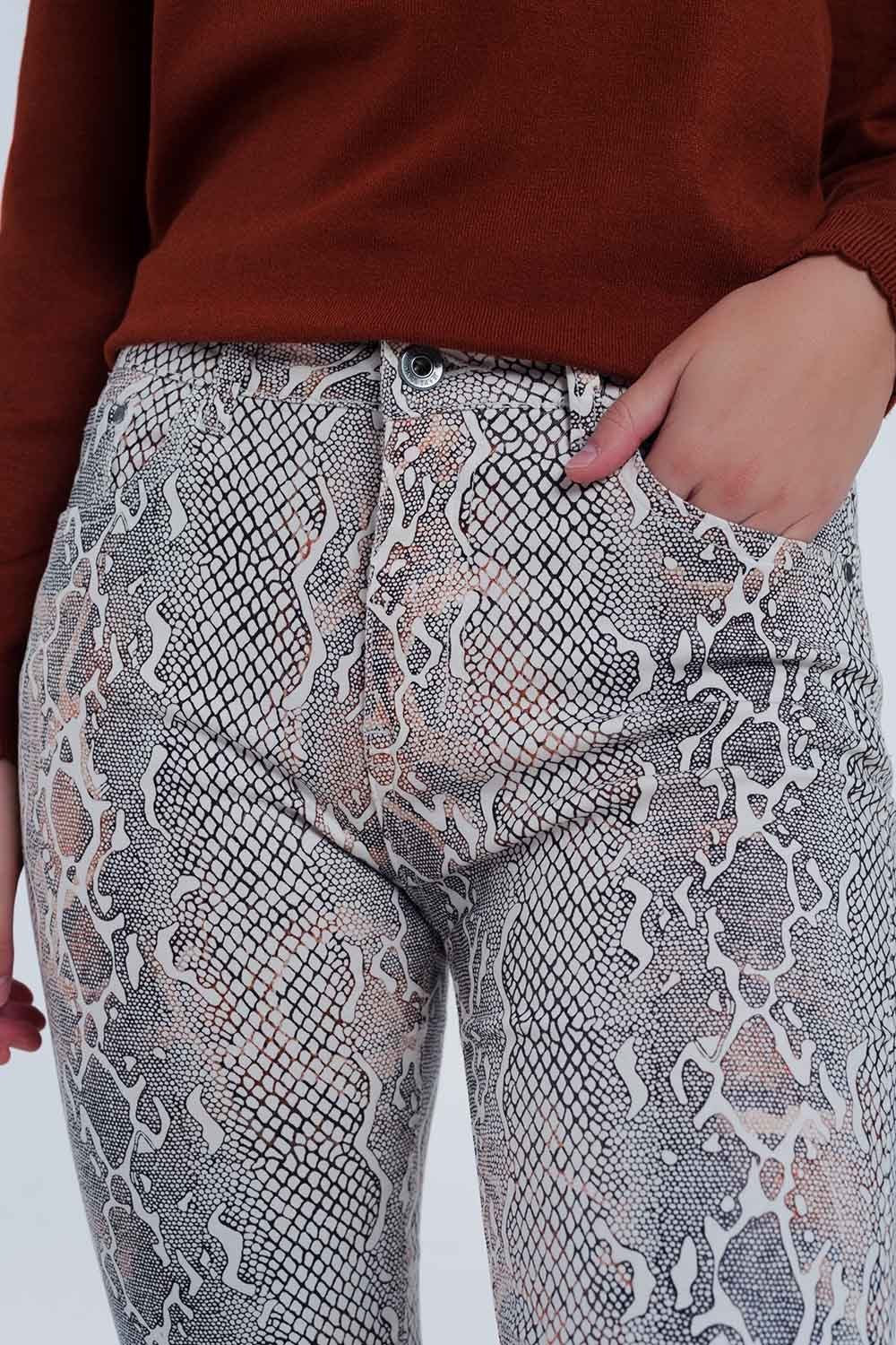 beige coloured pants with snake print - Trousers