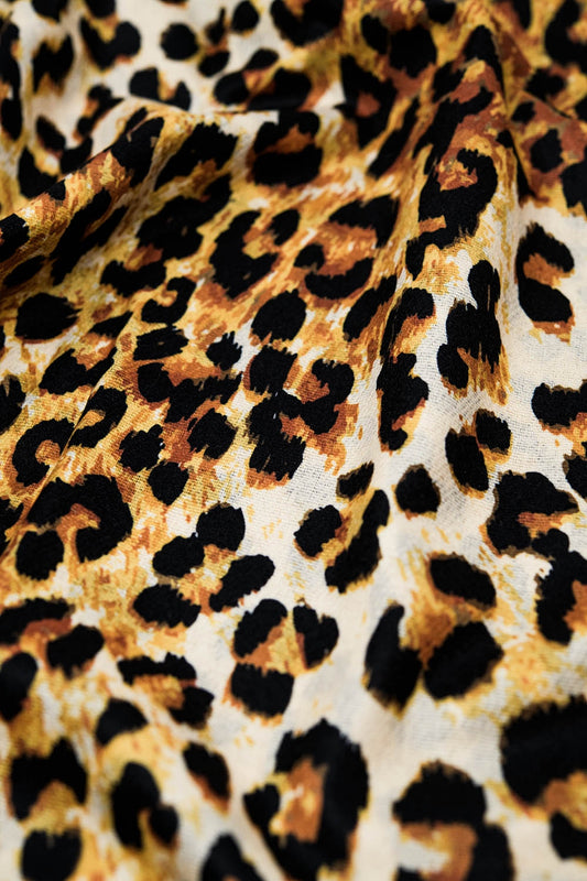 Fine woven scarf with leopard print in camel - Scarves