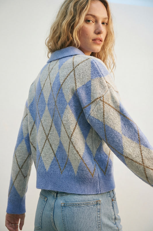 Fluffy argyle knit sweater in blue with polo collar showcased on a model from the back