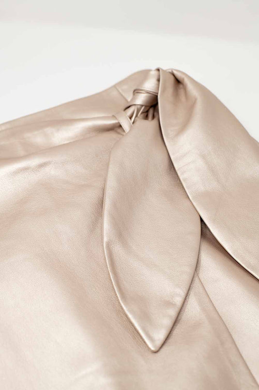 Gold faux leather mini skirt with bow on the side - Skirts