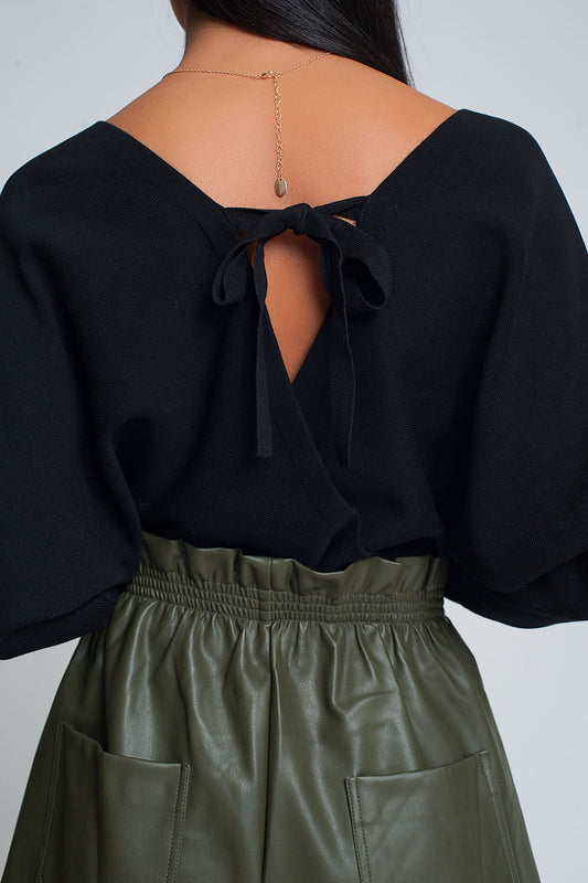 Knitted sweater with wrapped V-neck in black - Jumpers