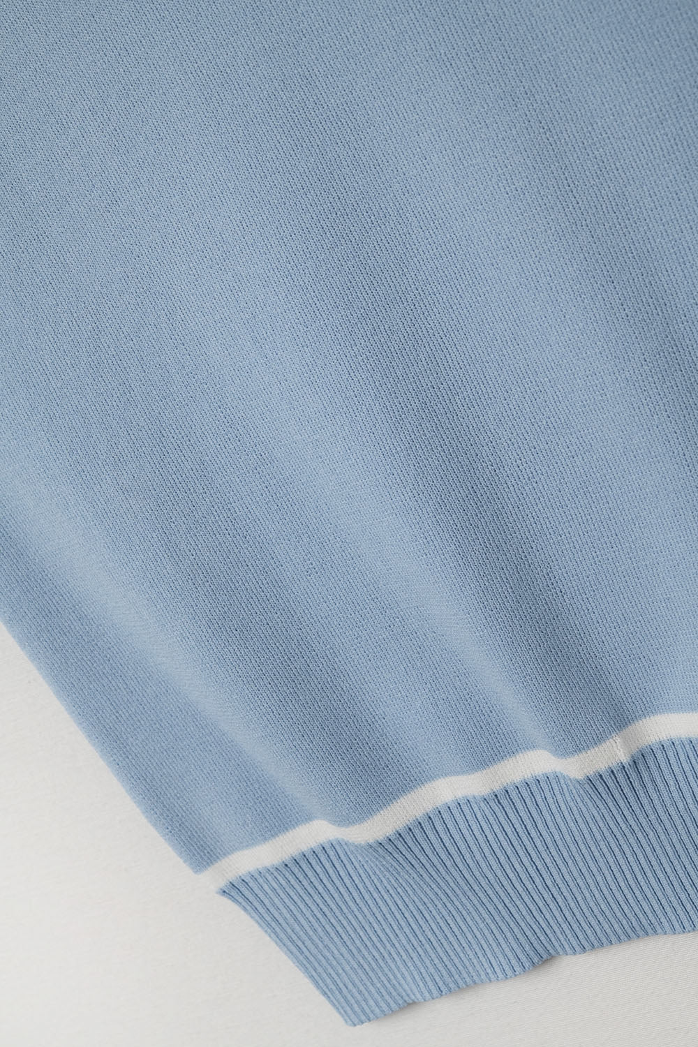 Sleeveless Sweater In Blue Featuring White Lines detail - Tops