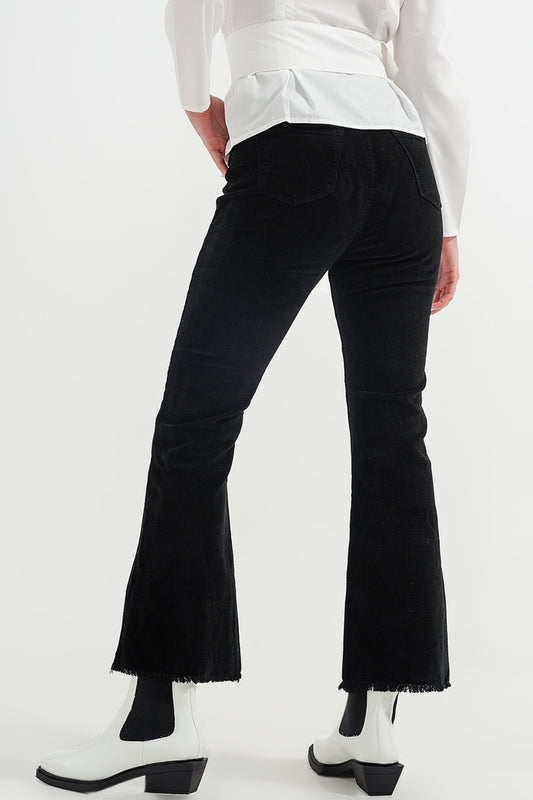 Stretchy cord flared trouser in black - Trousers