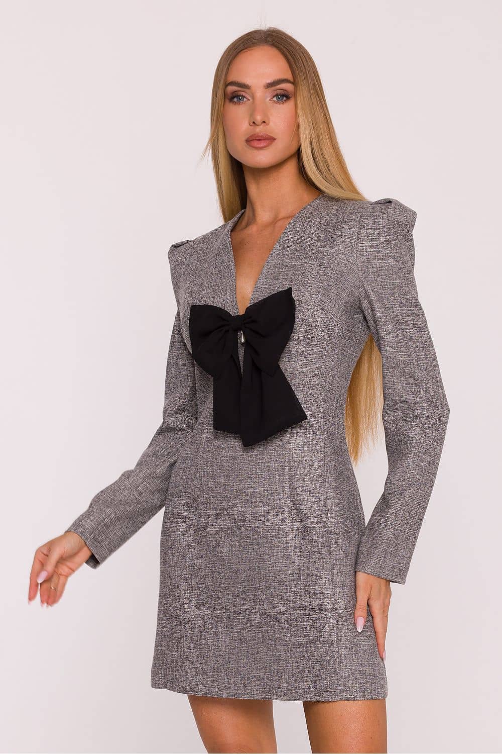 Model wearing a trendy women's dresses online collection animal print mini dress with long sleeves and layered skirt