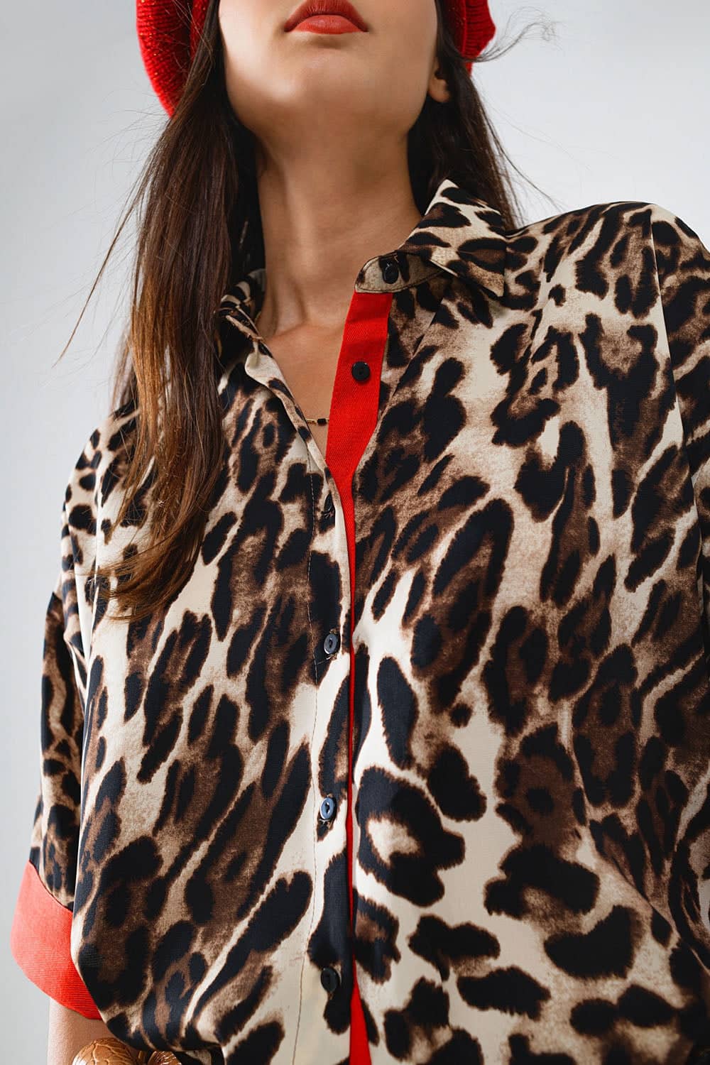 Close-up of a stylish leopard print blouse from versatile fashionable women's tops collection