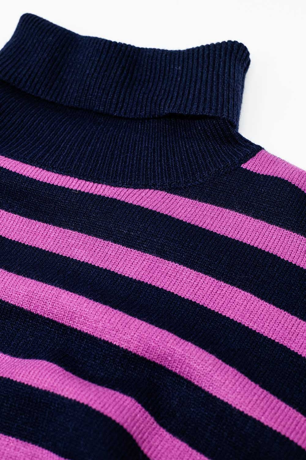 Navy oversized trutleneck sweater with fuchsia stripes and splits on the side
