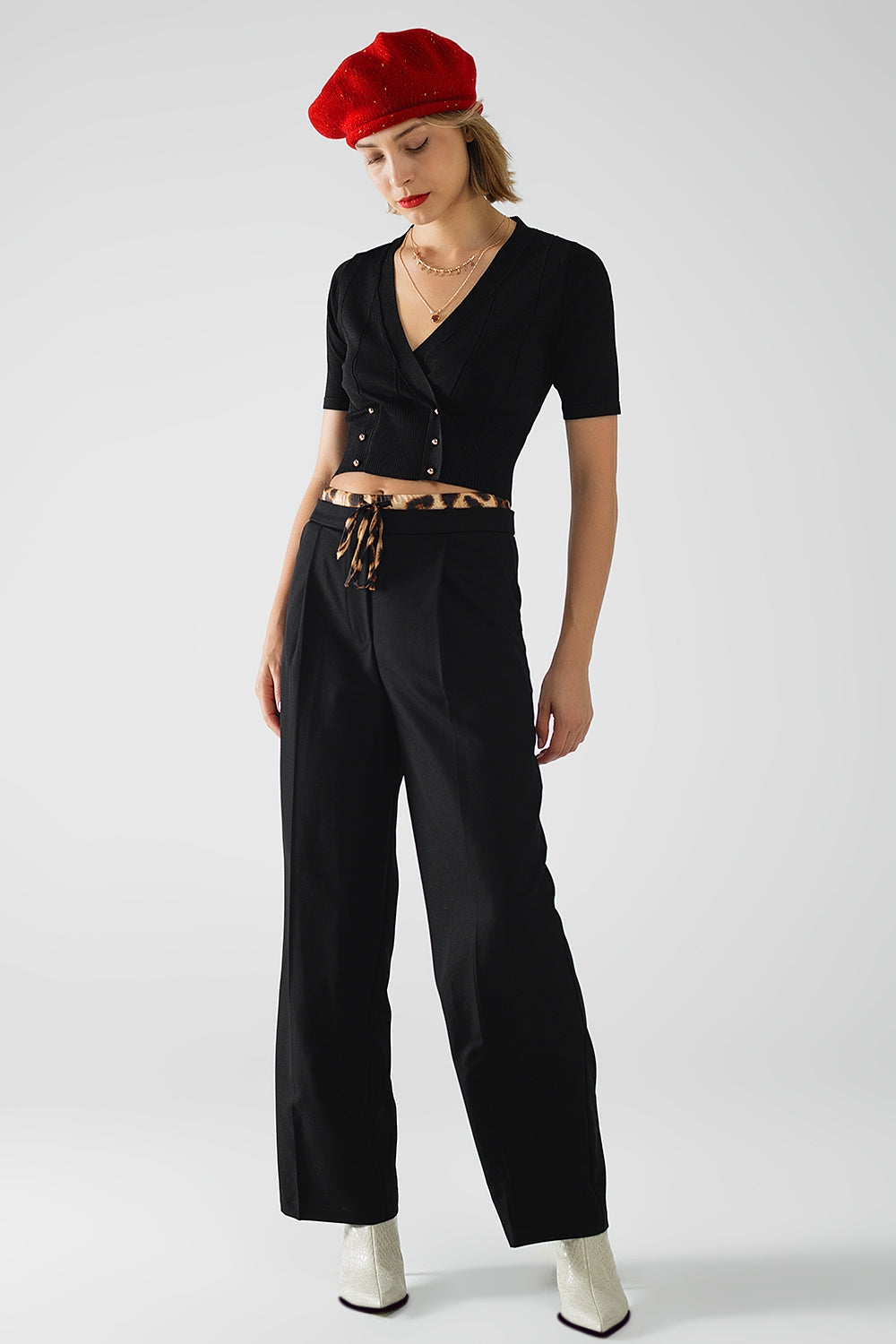 Long black pleated pants with leopard detail at the waist - trousers