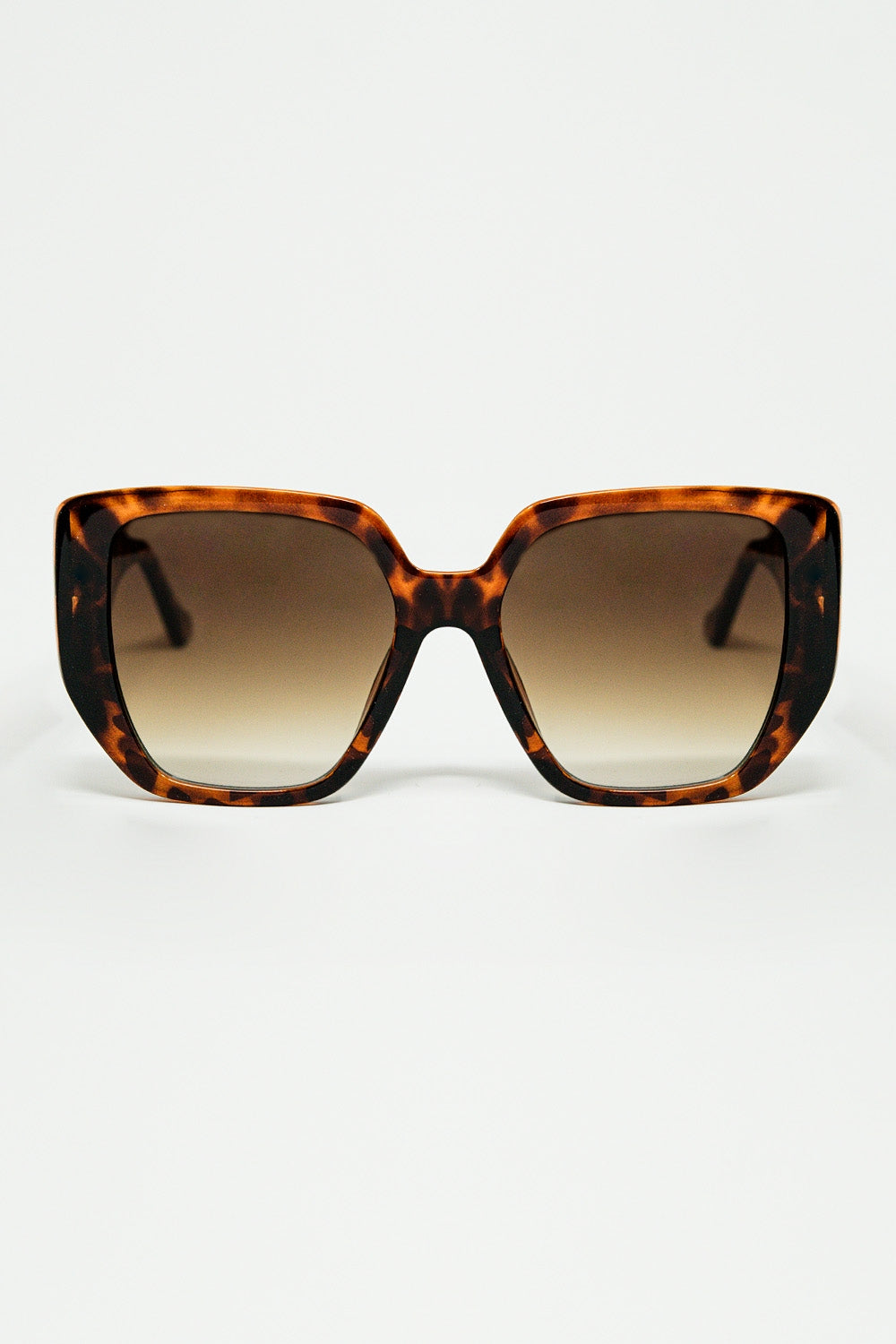 Brown pin-up style sunglasses with geometric design and cat eyes