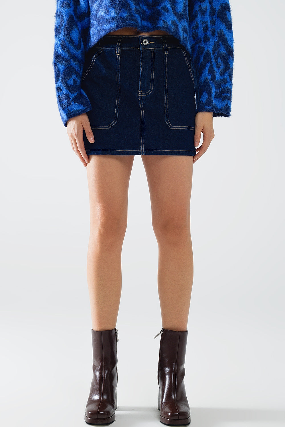 Dark wash denim mini skirt with front pockets