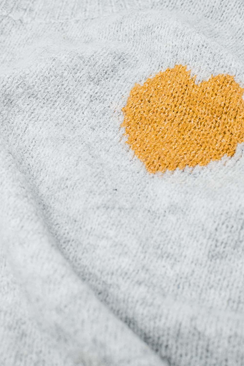 Grey sweater with boat neck and heart print