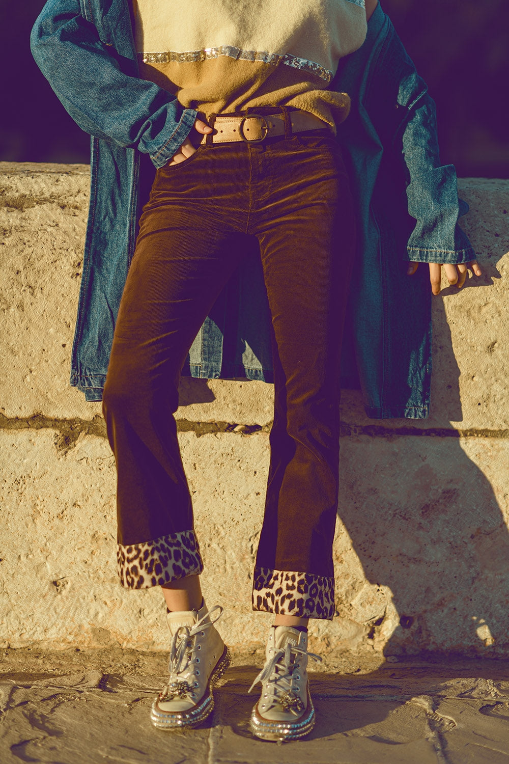 Brown corduroy flare pants with leopard print at the bottom - trousers