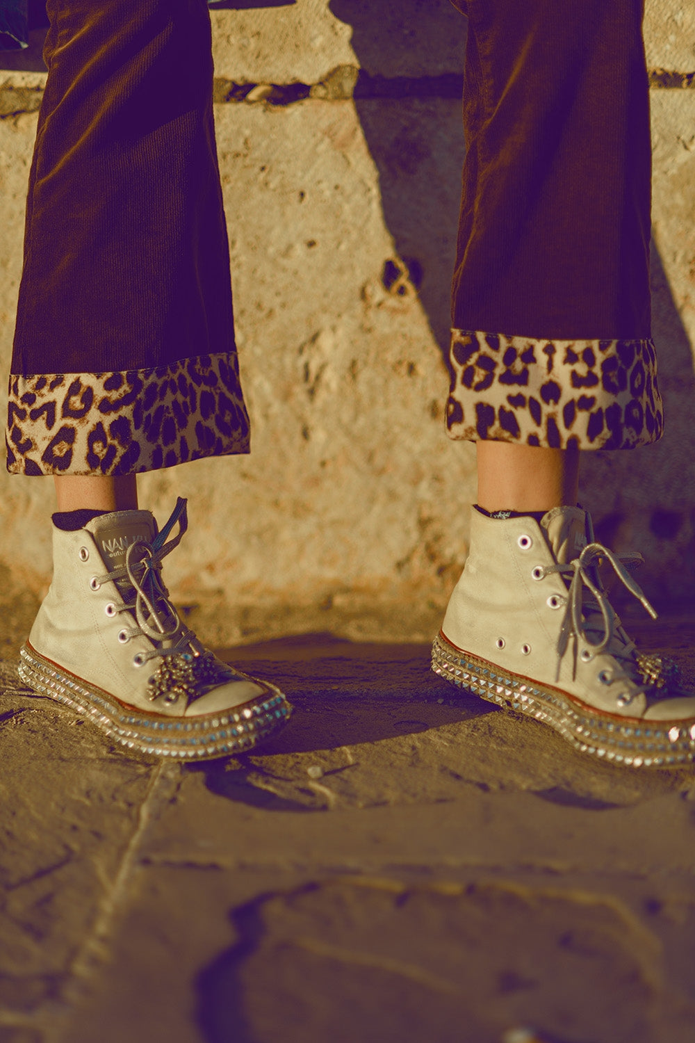 Brown corduroy flare pants with leopard print at the bottom - trousers