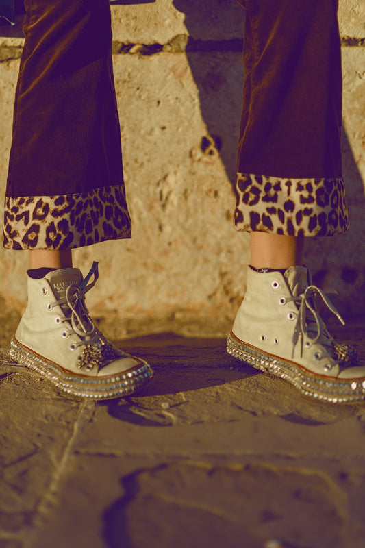 Brown corduroy flare pants with leopard print at the bottom - trousers