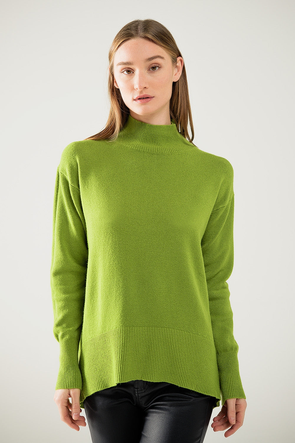 Loose green sweater with opening in the back
