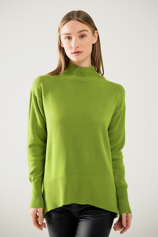 Loose green sweater with opening in the back