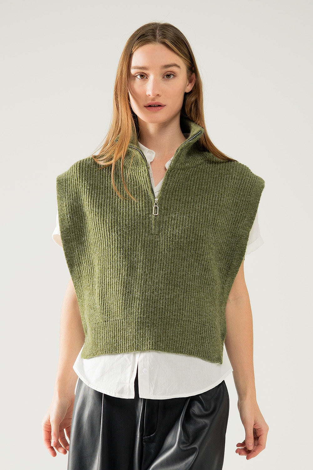 Green sleeveless turtleneck sweater with zipper closure