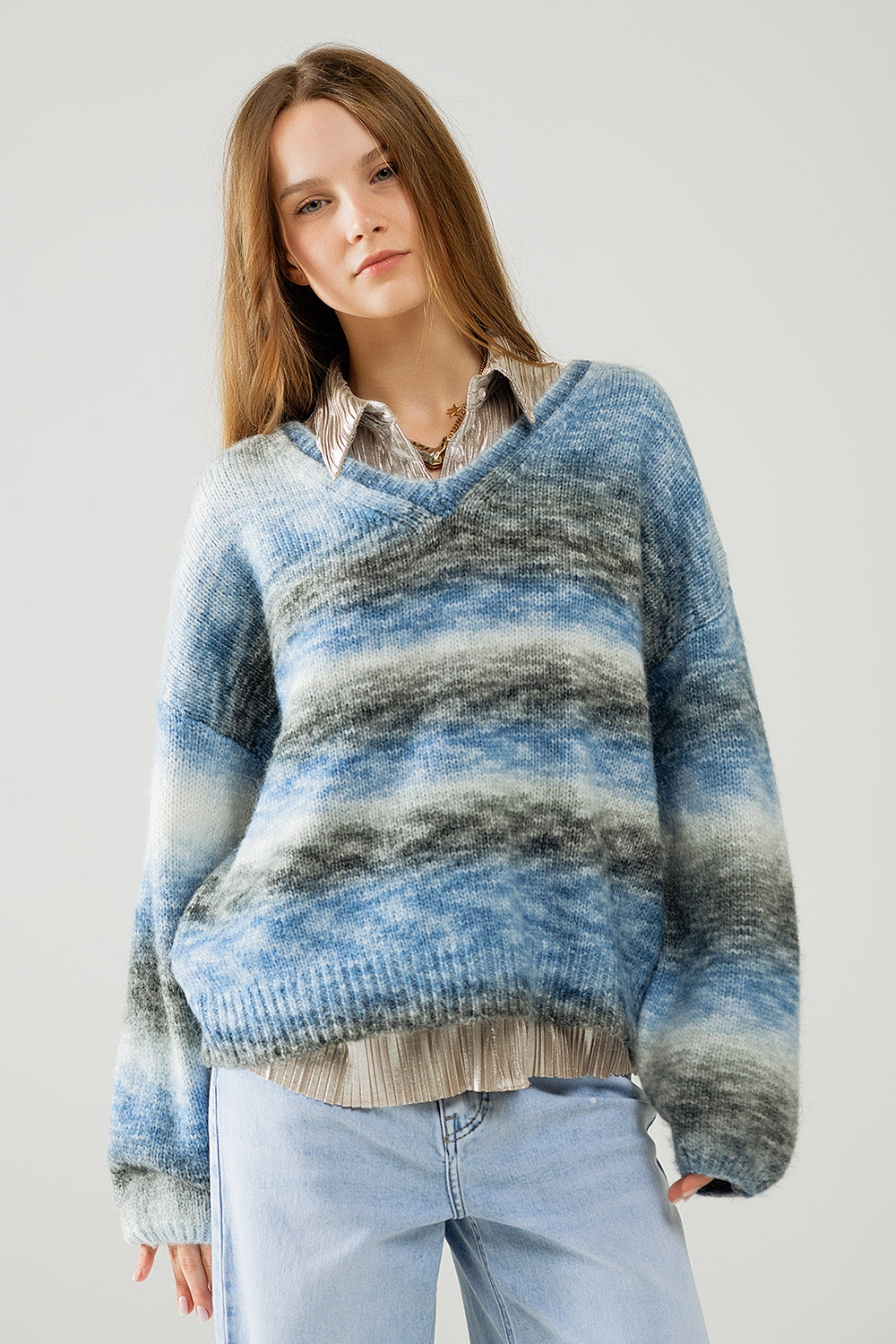 Loose V-neck sweater with blue and grey stripes