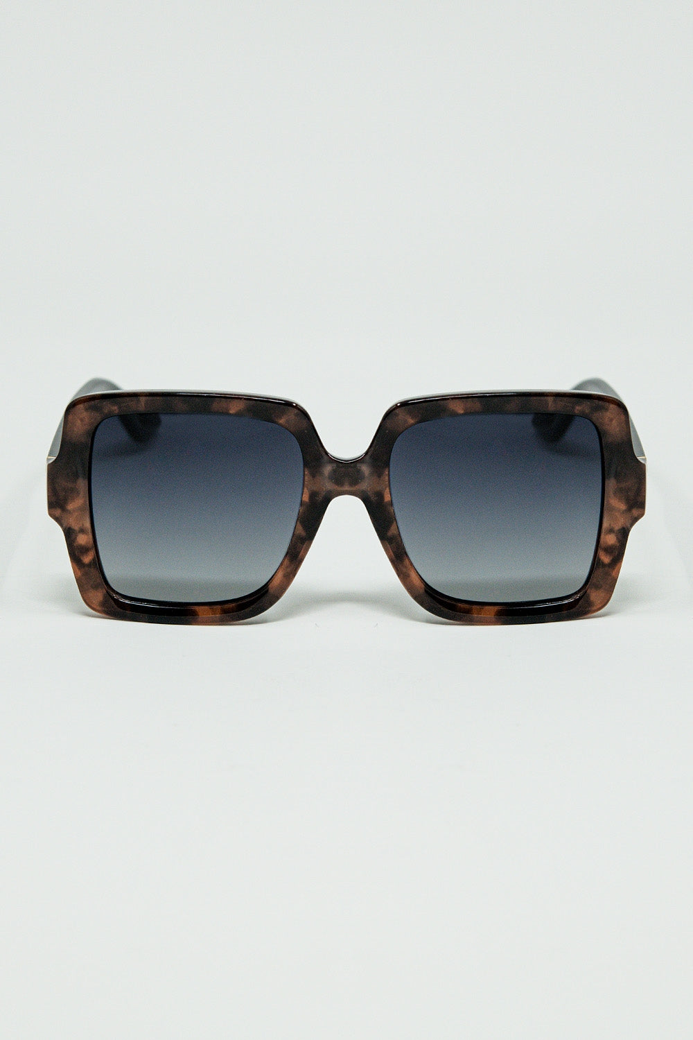 Sunglasses with a brown print frame and black temples