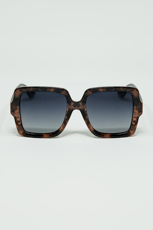Sunglasses with a brown print frame and black temples