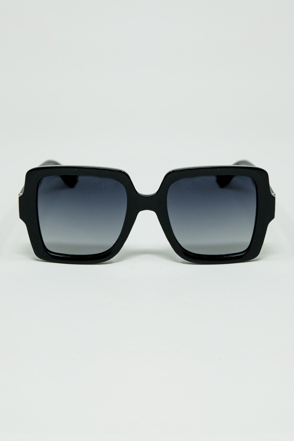 Wide square frame sunglasses with gold detail on the temples