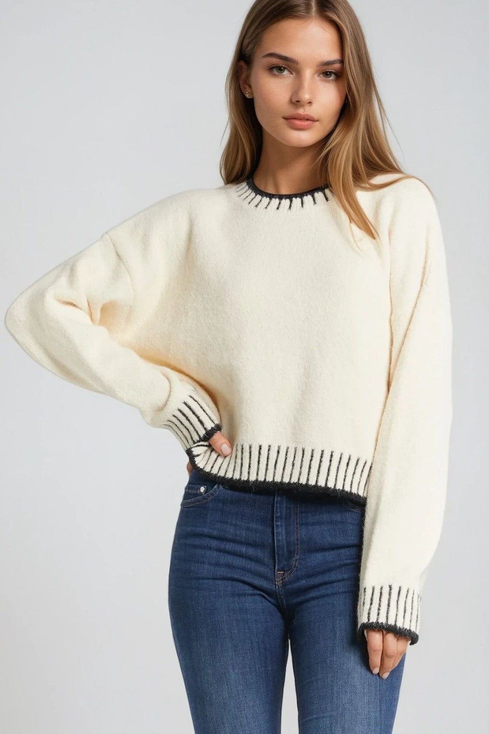 Fluffy cream sweater with ribbed detail at neck and hem