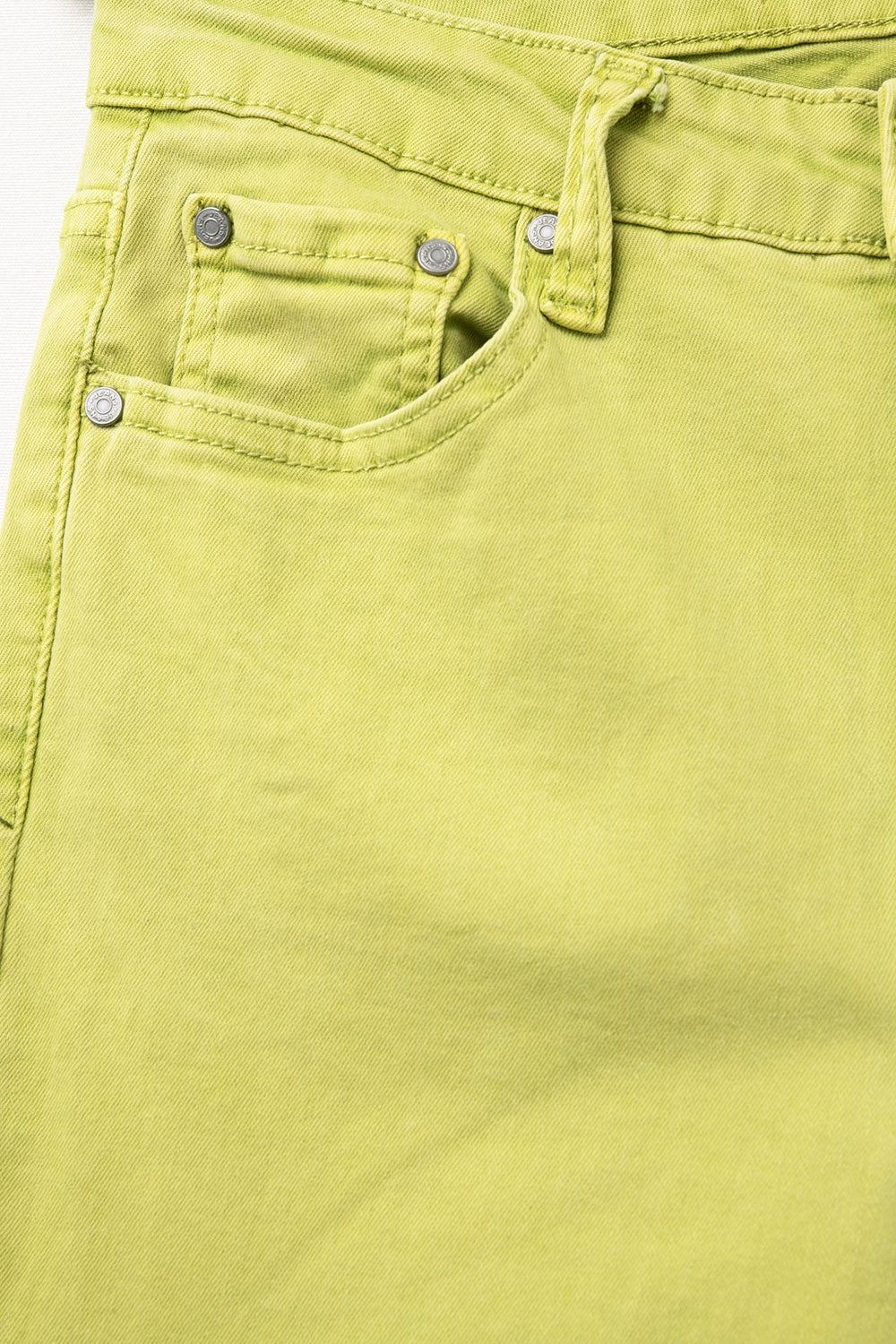 Flare jeans with raw hem edge in lime color - Coloured Jeans