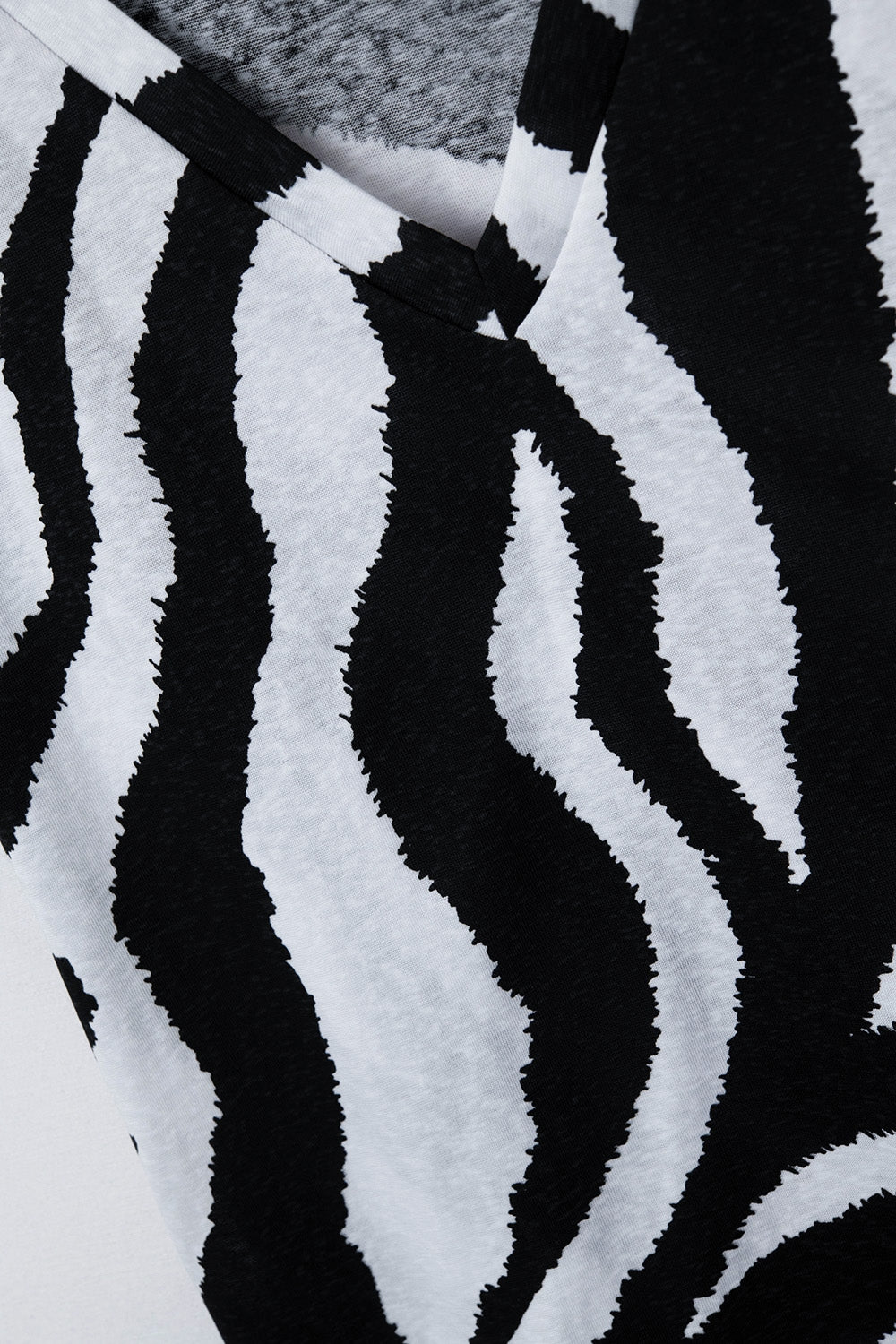 V-neck t-shirt with black zebra print - top