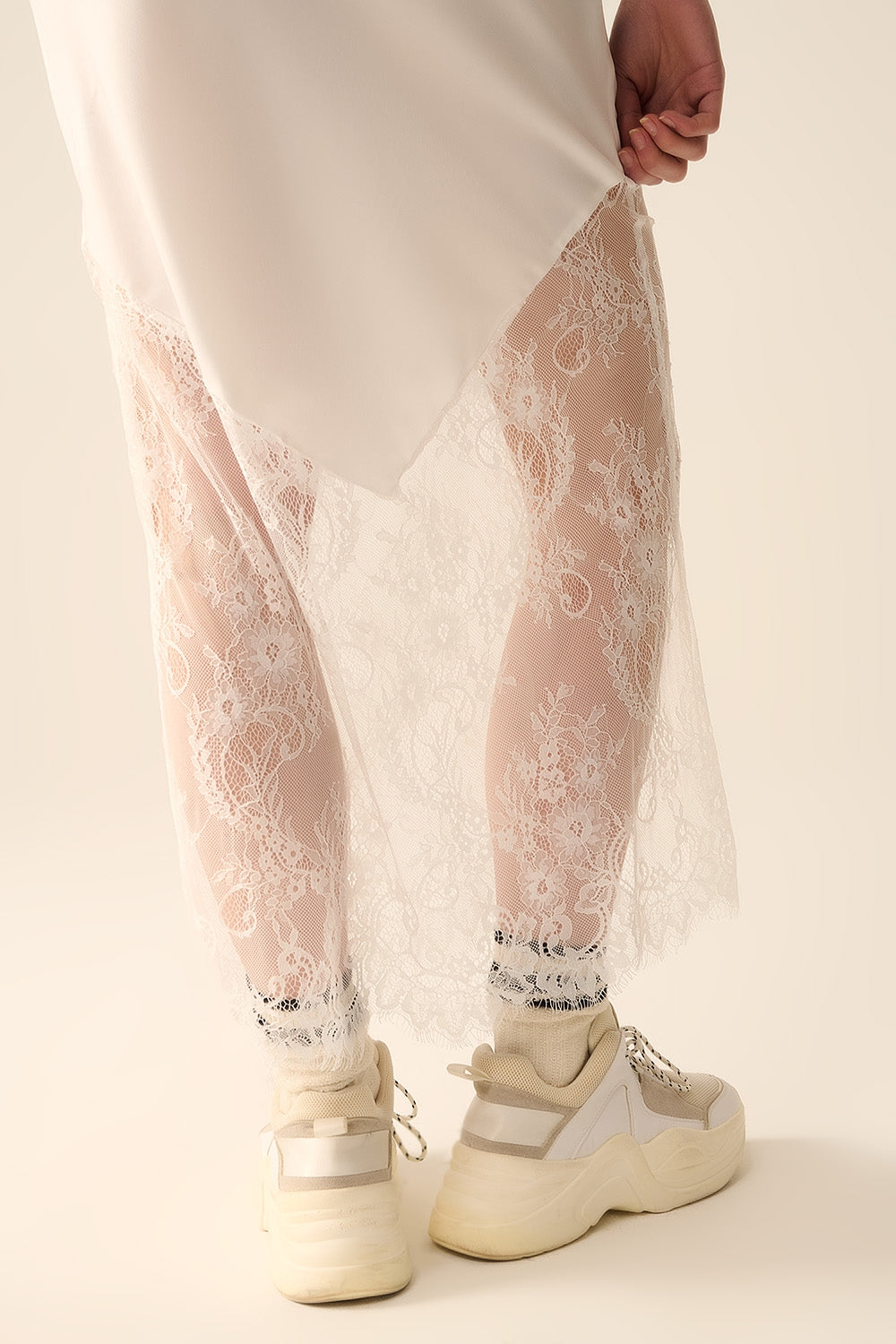 white satin skirt with lace at the bottom