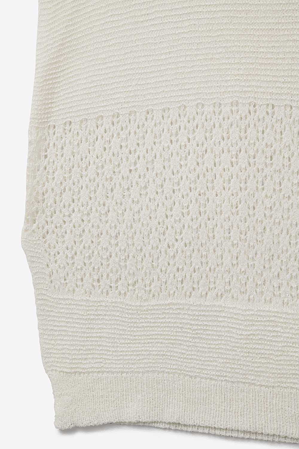 White sweater with soft open knit and dropped sleeves