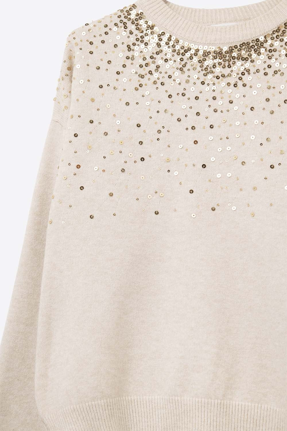 Cream soft knit sweater embellished with sequins on the front