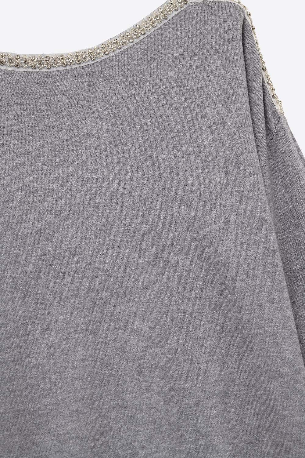 grey fine knit sweater with a boat neck and rhinestone detail