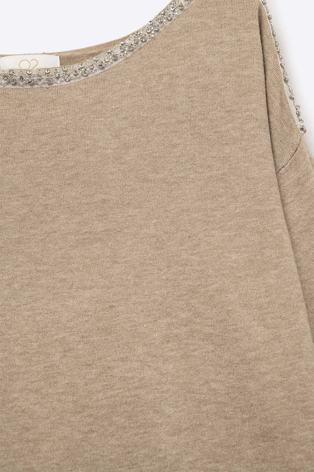 beige fine knit sweater with a boat neck and rhinestone detail